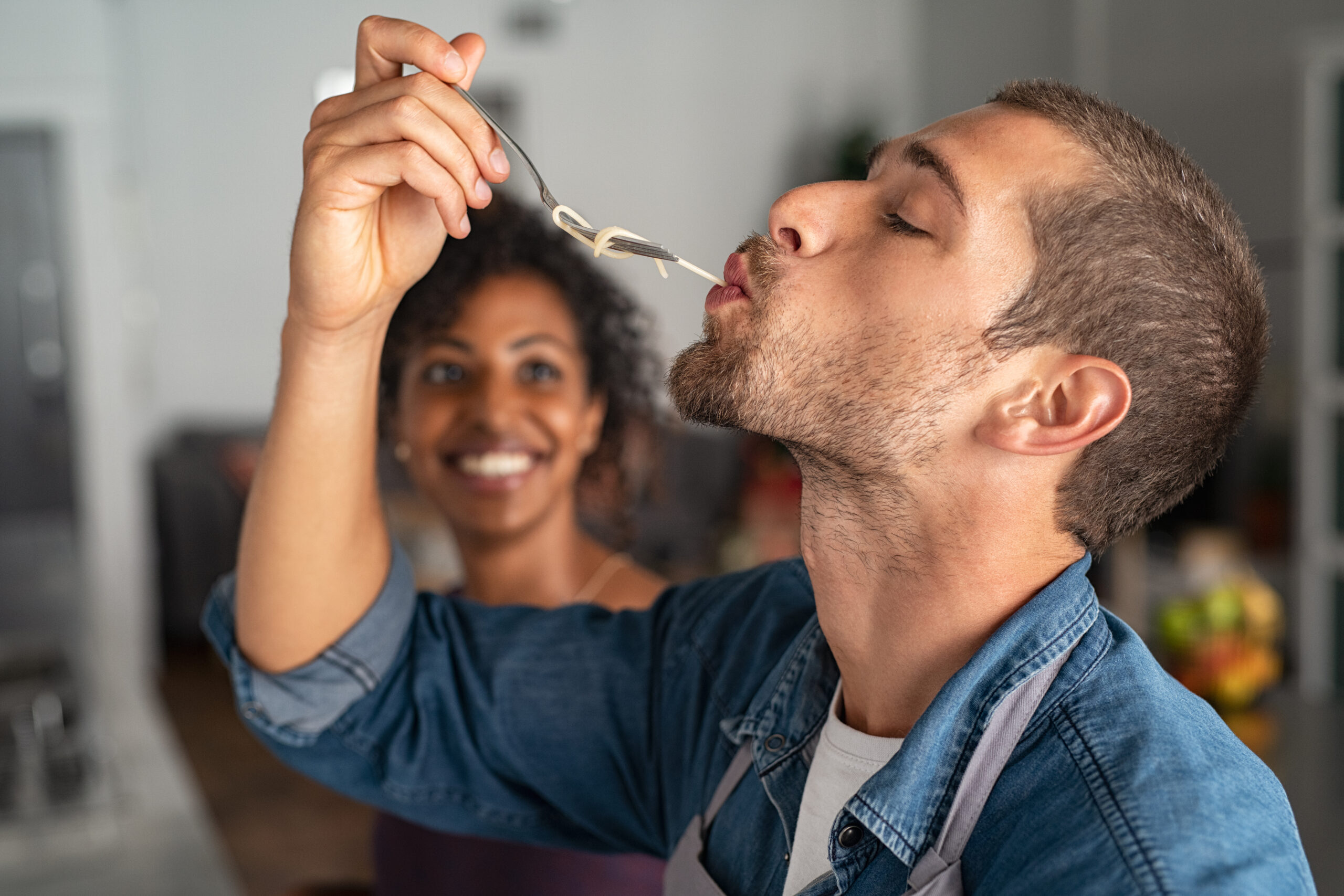 Man tasting spaghetti