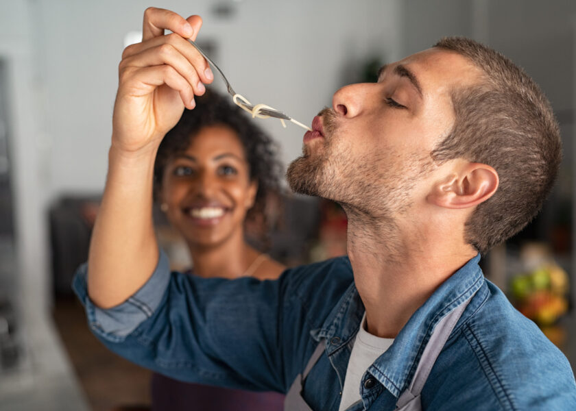 Man tasting spaghetti